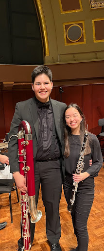 two musicians smiling after musical performance