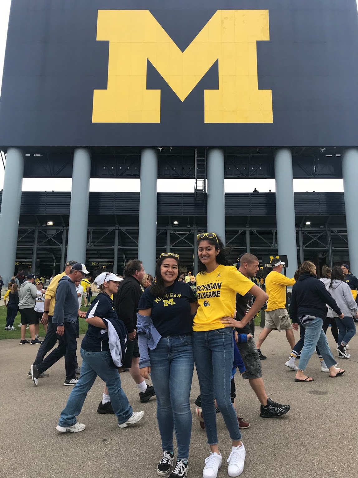 two girls in front of U-M football stadium