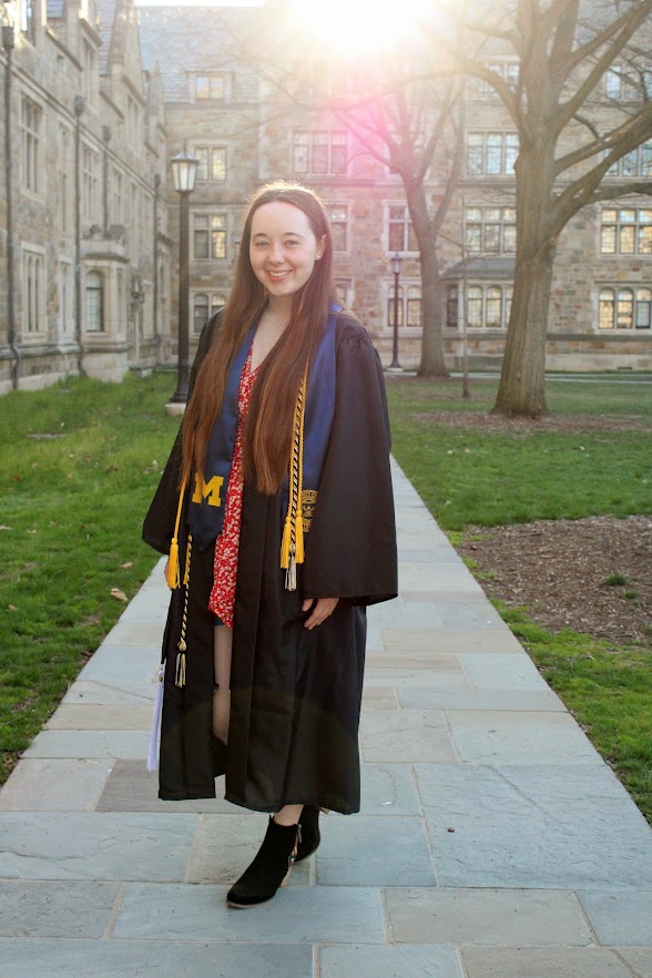 Bailey in Law Quad wearing cap and gown