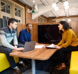 Three students having a meeting