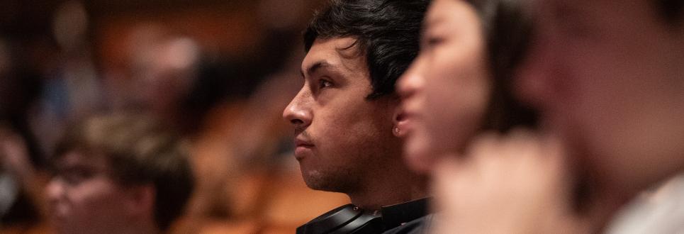 Two students intently listening to a lecture