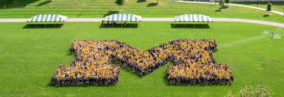 Students form a block M in an overhead photo